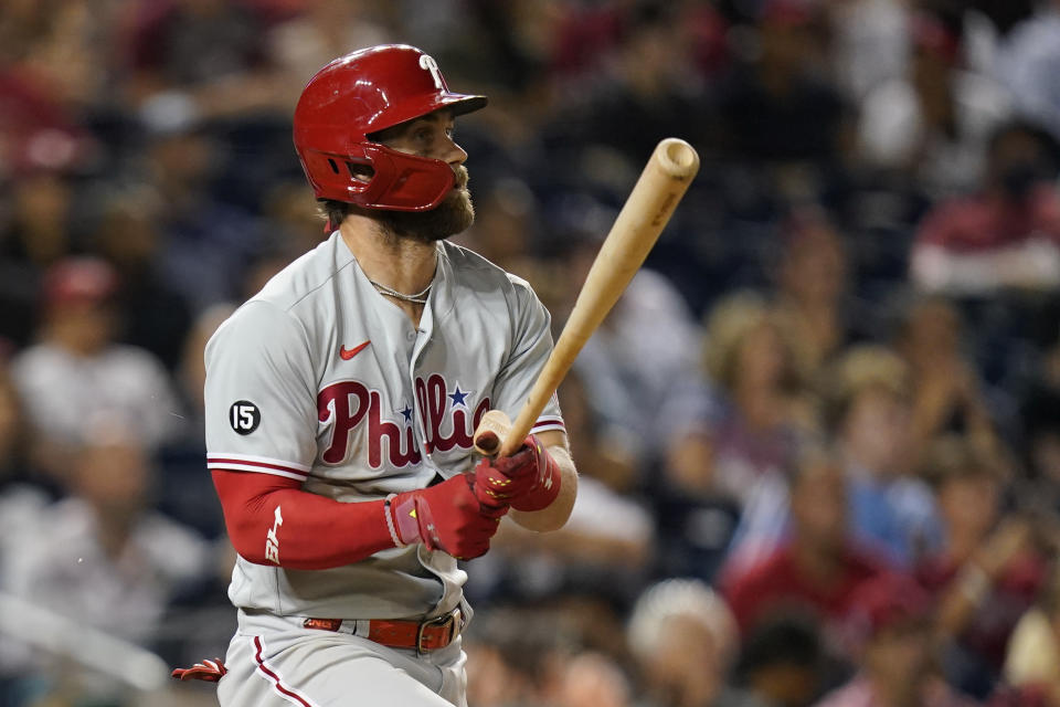 Philadelphia Phillies' Bryce Harper doubles in the eighth inning of a baseball game against the Washington Nationals, Wednesday, Aug. 4, 2021, in Washington. Travis Jankowski scored on the play. (AP Photo/Patrick Semansky)