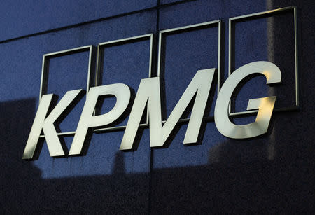 FILE PHOTO: A KPMG logo is seen on their down town office tower in Los Angeles, California May 13, 2014. REUTERS/Mike Blake