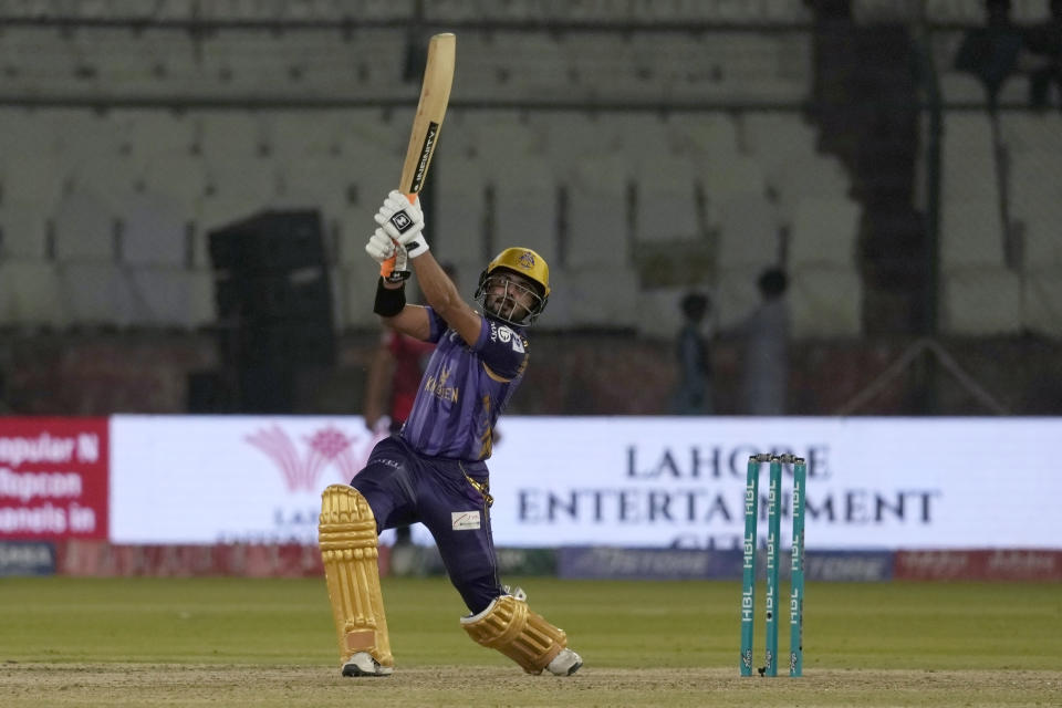 Quetta Gladiators' Saud Shakeel follows the ball after playing a shot for six during the Pakistan Super League T20 cricket match between Lahore Qalandars and Quetta Gladiators, in Karachi, Pakistan, Sunday, March 10, 2024. (AP Photo/Fareed Khan)