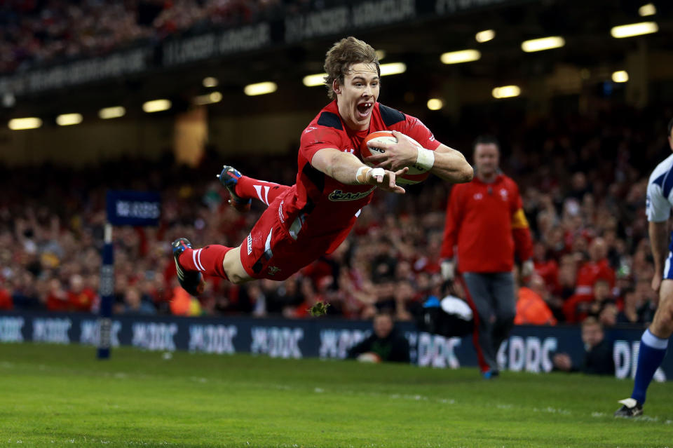 Wales' Liam Williams scores their first try during the Six Nations rugby union match between Wales and Scotland at the Millennium Stadium, Cardiff, Wales, Saturday, March 15, 2014. (AP Photo/David Davies, PA Wire) UNITED KINGDOM OUT - NO SALES - NO ARCHIVES