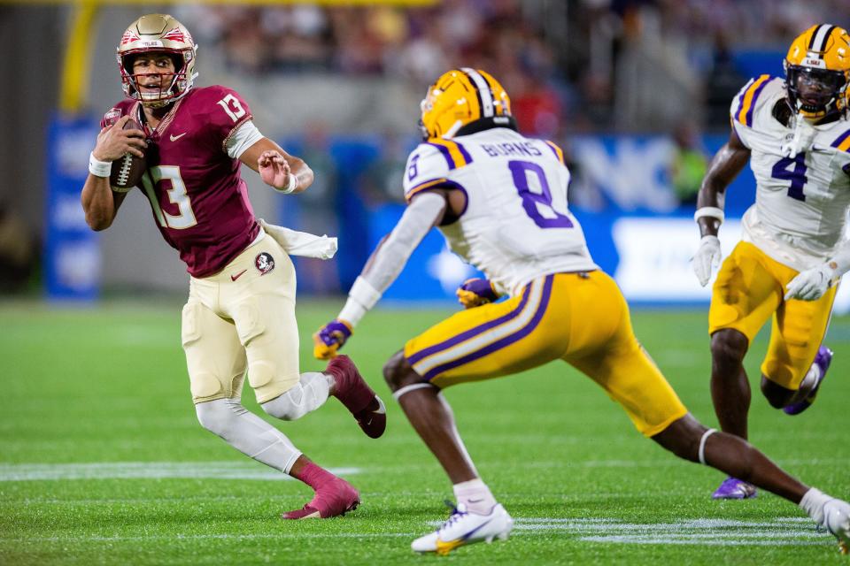 Florida State Seminoles quarterback Jordan Travis (13) looks towards the end zone as he runs the ball on Sunday, Sept. 3, 2023.