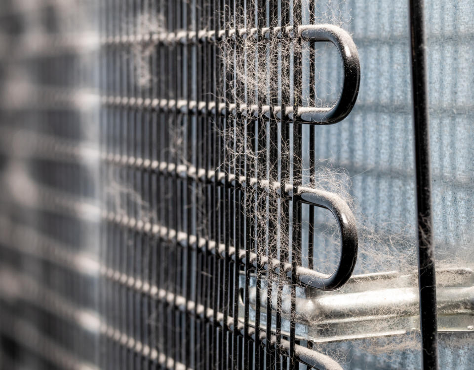 Clean the condenser coils and the back of the refrigerator