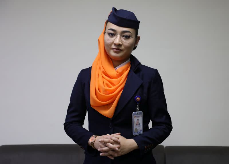 Shagufa Haidary, 23, Kam Air flight attendant poses for a photo after an interview in Kabul