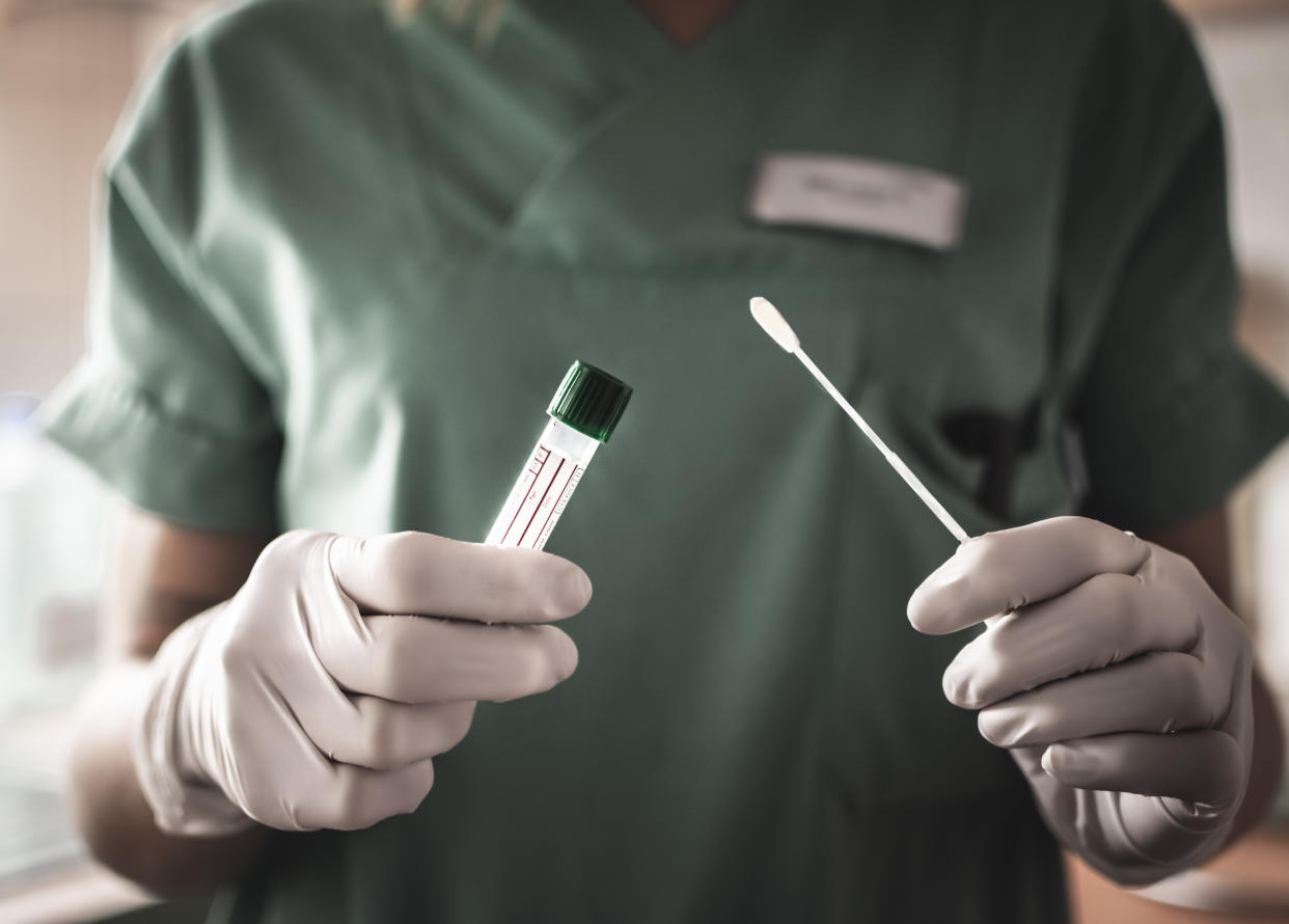 nurse holds a swab for the coronavirus / covid19 test