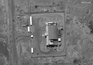 This satellite image from Maxar Technologies shows vehicles at the checkout building at Imam Khomeini Space Center southeast of Semnan, Iran on Tuesday, June 14, 2022. Iran appeared to be readying for a space launch Tuesday as satellite images showed a rocket on a rural desert launch pad, just as tensions remain high over Tehran's nuclear program. The images from Maxar Technologies showed a launch pad at Imam Khomeini Spaceport in Iran’s rural Semnan province, the site of frequent recent failed attempts to put a satellite into orbit. (Satellite image ©2022 Maxar Technologies via AP)
