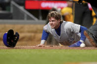 Chicago Cubs' Nico Hoerner scores during the fifth inning of a baseball game against the Pittsburgh Pirates, Friday, May 10, 2024, in Pittsburgh. (AP Photo/Matt Freed)