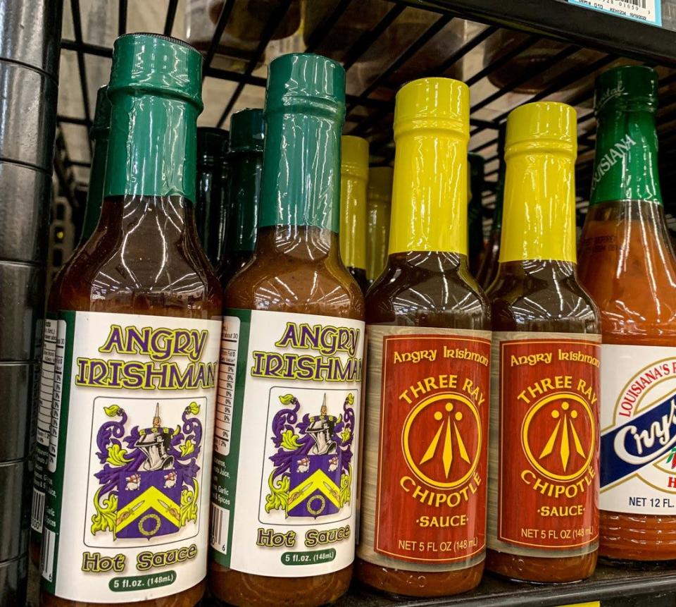 Bottles of Angry Irishman hot sauce line a shelf at Bassett’s Market in Port Clinton. The hot sauce can be purchased in many local stores.