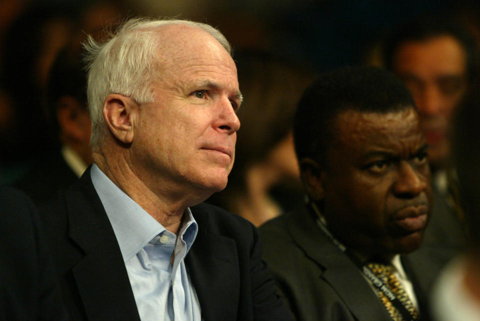 Sen. John McCain (L) watches the 2004 middleweight title bout in Las Vegas between Bernard Hopkins and Oscar De La Hoya along with former Nevada Athletic Commission chairman Luther Mack of Reno. (Getty Images)