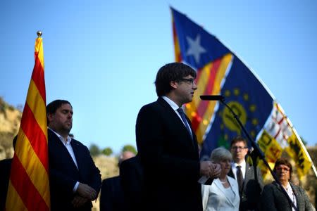 Catalan President Carles Puigdemont delivers a speech at the memorial of "Fossar de la Pedrera" (Pedrera mass grave) in Barcelona, Spain, October 15, 2017. REUTERS/Ivan Alvarado