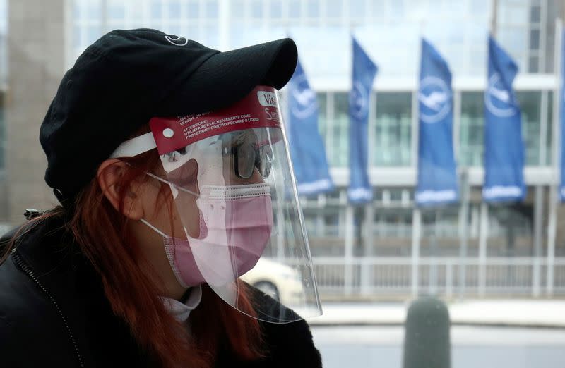 Flight passenger wears a protective mask at Frankfurt Airport