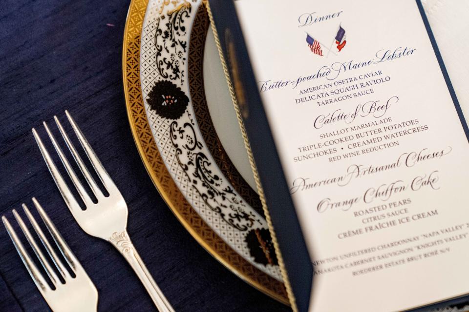 A table is set during a media preview for the State Dinner with President Joe Biden and French President Emmanuel Macron in the State Dining Room of the White House in Washington, Wednesday, Nov. 30, 2022. (AP Photo/Andrew Harnik)