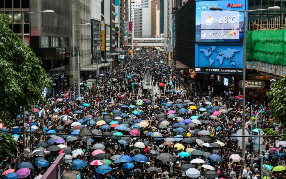 Pro-democracy protesters in Hong Kong in 2019. Many were forced to flee to the UK