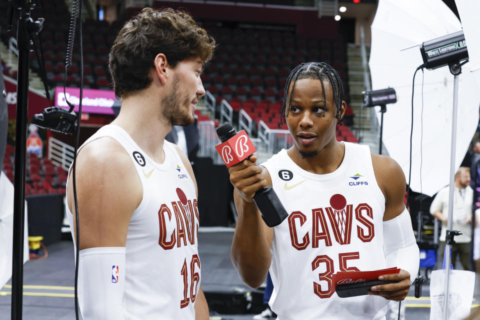 Cleveland Cavaliers forward Isaac Okoro (35) interviews forward Cedi Osman (16) during the NBA basketball team's media day, Monday, Sept. 26, 2022, in Cleveland. (AP Photo/Ron Schwane)