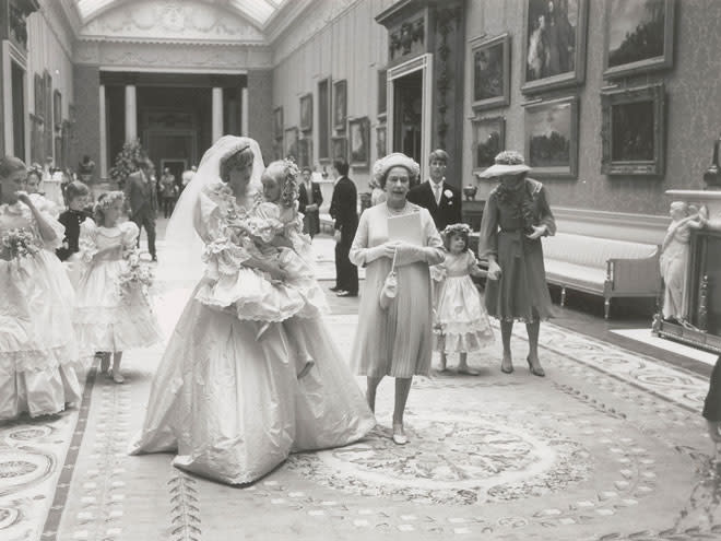 <p>In her arms, Diana cradles Clementine Hambro, who, at just 5 years old, was her youngest bridesmaid.</p>