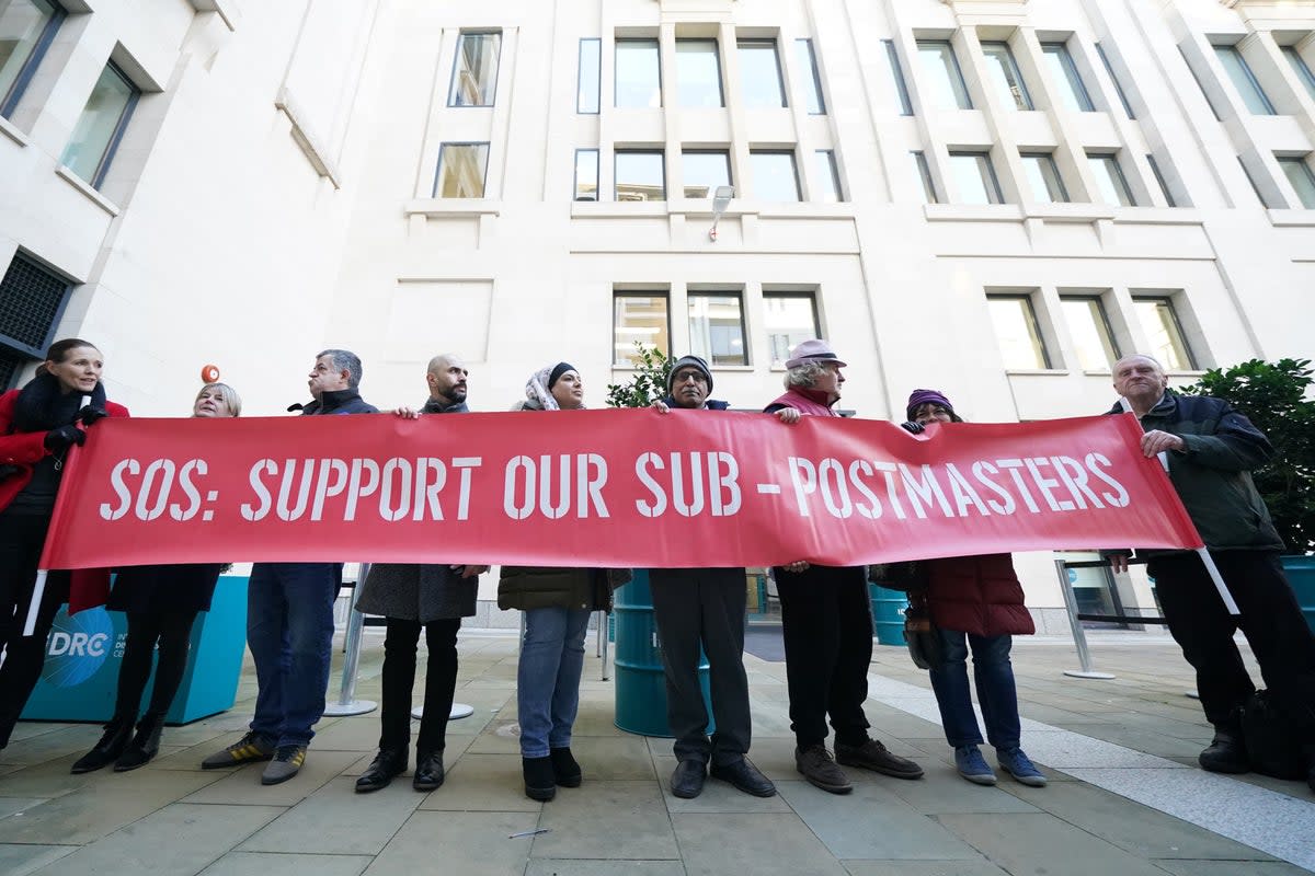 Protesters outside a hearing of the Post Office Horizon IT inquiry  (Kirsty O’Connor/PA)