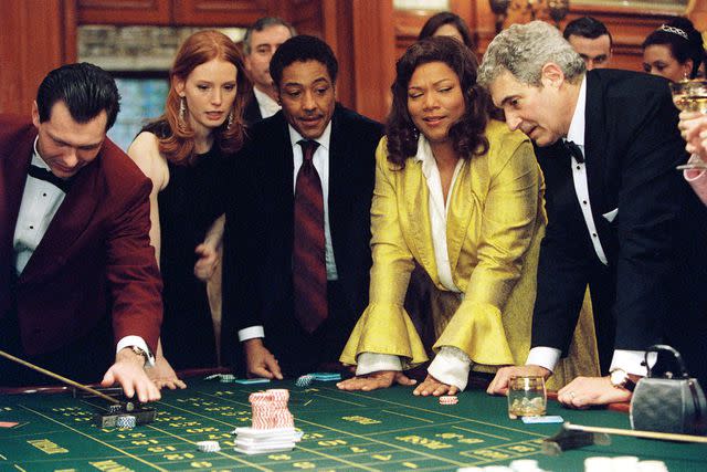 <p>Stephen Vaughan/Paramount/Kobal/Shutterstock</p> Alicia Witt, Giancarlo Esposito, Queen Latifah, and Michael Nouri in 'Last Holiday'.