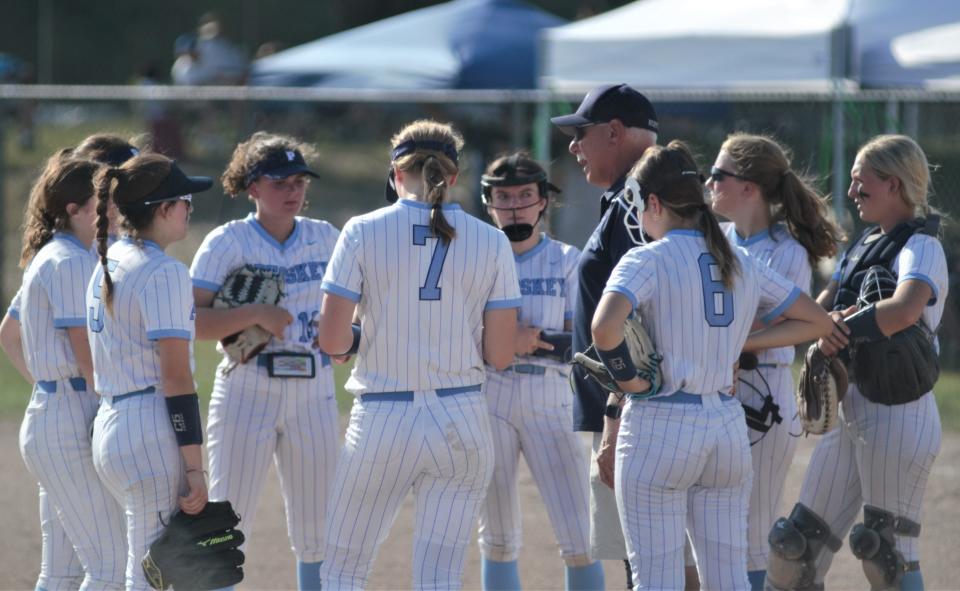 Petoskey head coach Dave Serafini talks with his team during Tuesday's Division 2 district opener at Gaylord.