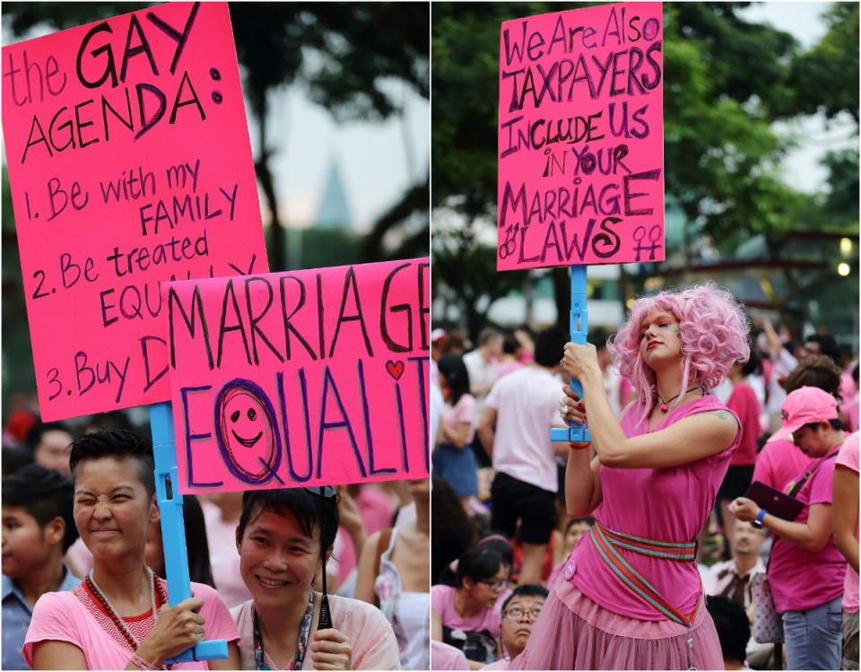 Female participants holding ups placard during a 2012 Pink Dot event. (Getty Images file photo)