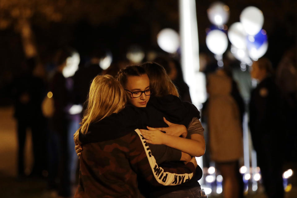 Students embrace during a vigil at Central Park in the aftermath of a shooting at Saugus High School Thursday, Nov. 14, 2019, in Santa Clarita, Calif. Los Angeles County sheriff’s officials say a 16-year-old student shot five classmates and then himself in a quad area of Saugus High School Thursday morning. (AP Photo/Marcio Jose Sanchez)