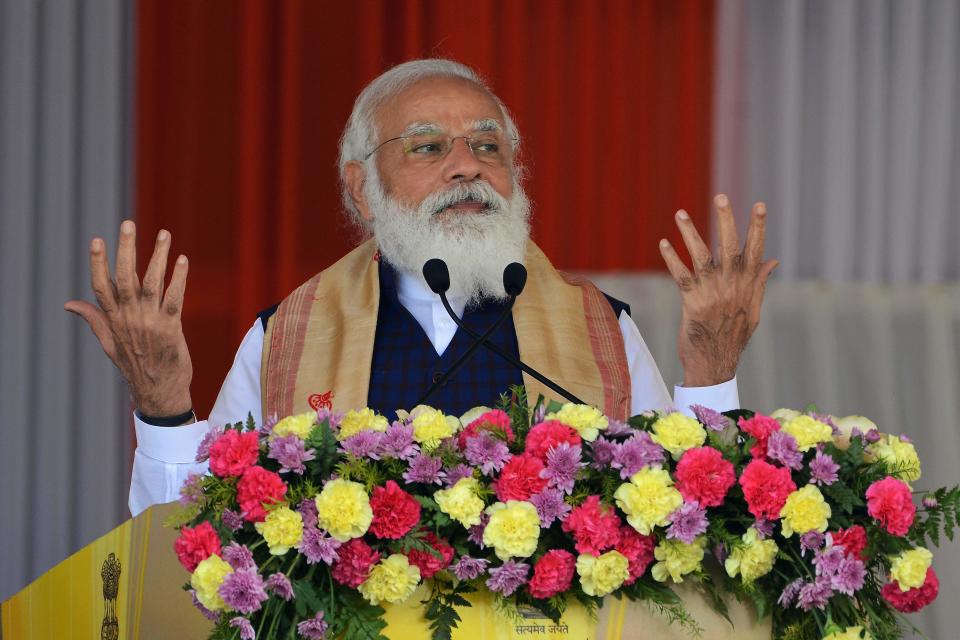 Indian Prime Minister Narendra Modi gestures as he addresses a public meeting at Jerenga Pathar in Sivasagar district of India's Assam state on January 23, 2021. (Photo by Biju BORO / AFP) (Photo by BIJU BORO/AFP via Getty Images)