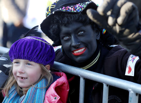 "Zwarte Piet" (Black Pete), who is a Saint Nicholas' assistant is seen during a traditional parade in Zaanstad, Netherlands, November 17, 2018. Picture taken November 17, 2018. REUTERS/Eva Plevier