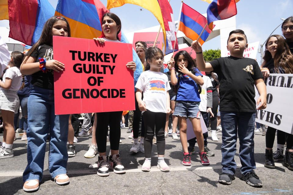 Armenian Americans children commemorate the 108th anniversary of the Armenian Genocide Remembrance Day with a protest outside the Consulate of Turkey in Beverly Hills, Calif. (AP Photo/Damian Dovarganes)
