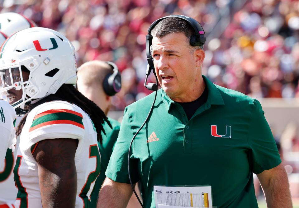 Oct 15, 2022; Blacksburg, Virginia, USA;  Miami Hurricanes head coach Mario Cristobal walks on the sidelines during the second quarter against the Virginia Tech Hokies at Lane Stadium. Mandatory Credit: Reinhold Matay-USA TODAY Sports