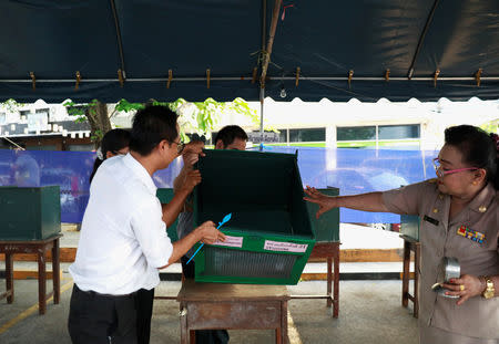 Officials inspect empty ballot boxes at a polling station ahead of the general election in Bangkok, Thailand, March 24, 2019. REUTERS/Soe Zeya Tun
