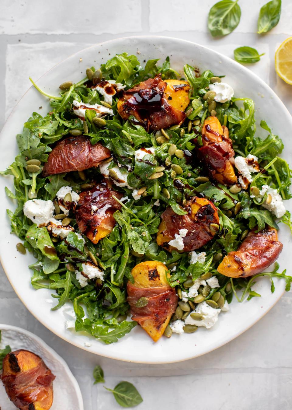 Grilled Prosciutto Wrapped Peaches With Arugula and Goat Cheese from How Sweet Eats