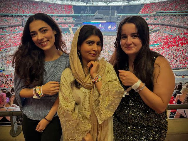 <p>Malala Yousafzai/Instagram</p> Malala Yousafzai (center) with friends at Taylor Swift's London concert