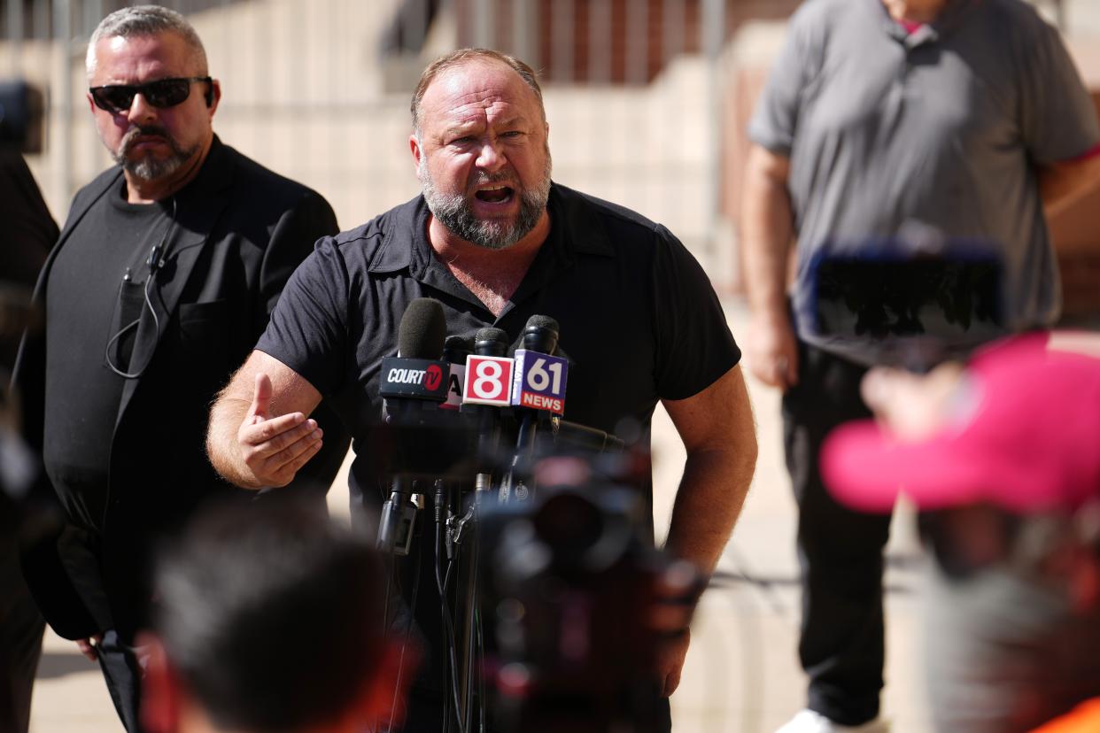 InfoWars founder Alex Jones speaks to the media outside Waterbury Superior Court during his trial on September 21, 2022 in Waterbury, Connecticut.