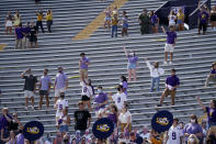 A limited number of fans in the student section, seated according to COVID-19 restrictions requiring social distancing and masks, watch in the first half an NCAA college football game between LSU and Mississippi State in Baton Rouge, La., Saturday, Sept. 26, 2020. Mississippi State won 44-34. (AP Photo/Gerald Herbert)