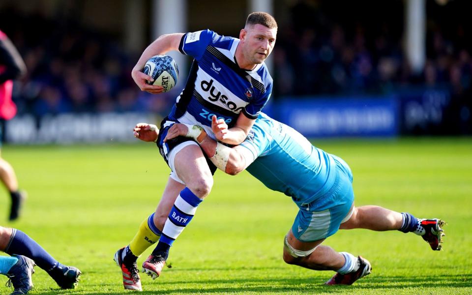 Finn Russell tackled by Sale Sharks' Sam Dugdale
