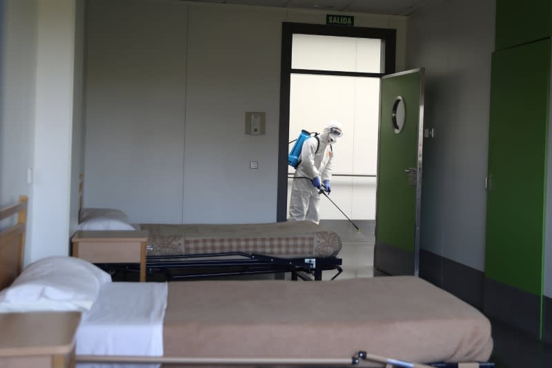 Member of Emergency Military Unit (UME) disinfects the interior of a special facility for psychically disabled people in Getafe