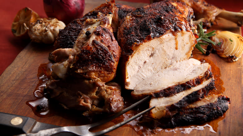 deep fried turkey on carving board