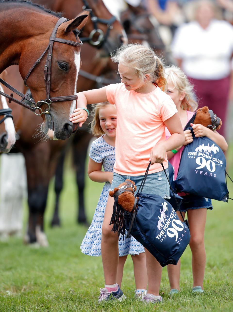 STROUD, UNITED KINGDOM - AUGUST 03: (EMBARGOED FOR PUBLICATION IN UK NEWSPAPERS UNTIL 24 HOURS AFTER CREATE DATE AND TIME) Mia Tindall, Savannah Phillips and Isla Phillips meet horses of the Pony Club as they attend day 2 of the 2019 Festival of British Eventing at Gatcombe Park on August 3, 2019 in Stroud, England. (Photo by Max Mumby/Indigo/Getty Images)