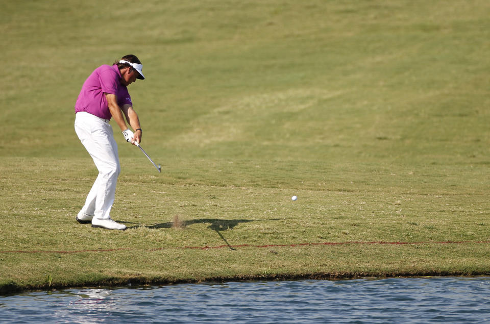 Phil Mickelson hits from the 18th fairway during the second round of the PGA Byron Nelson Championship golf tournament Friday, May 18, 2012, in Irving, Texas. (AP Photo/Tony Gutierrez)