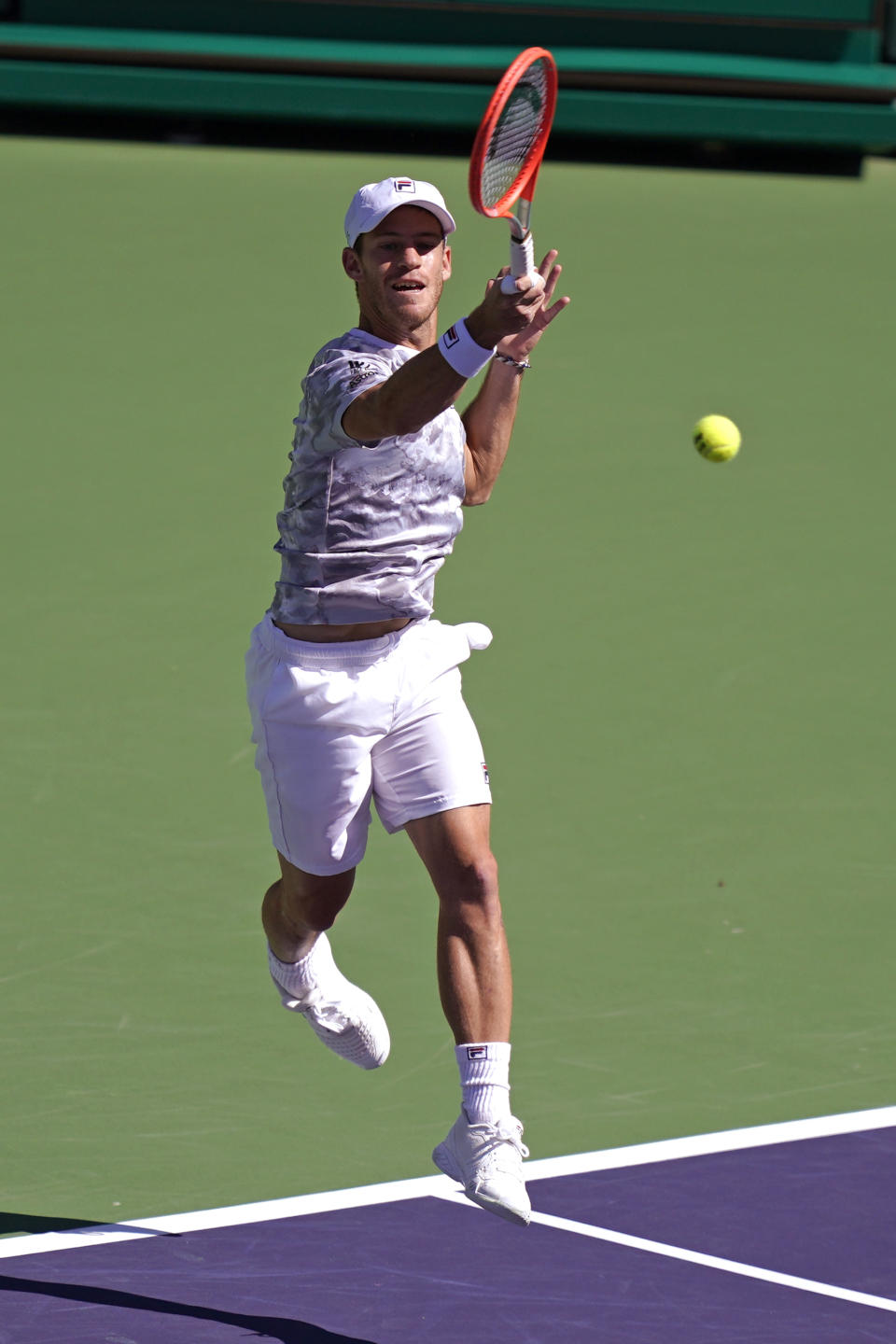 Diego Schwartzman, of Argentina, returns a shot to Cameron Norrie, of Britain, at the BNP Paribas Open tennis tournament Thursday, Oct. 14, 2021, in Indian Wells, Calif. (AP Photo/Mark J. Terrill)