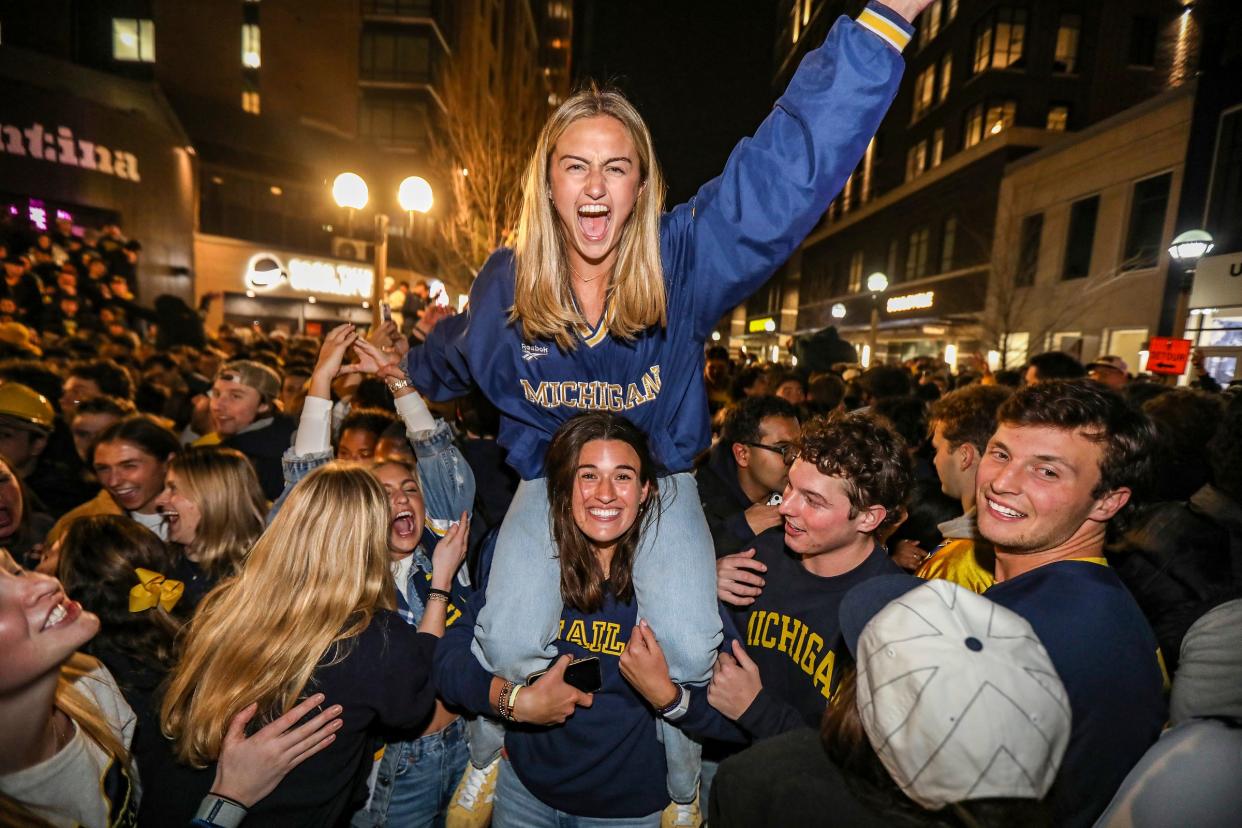 Michigan Wolverine fans take to the streets to celebrate their win at the College Football National Championship against Washington in Ann Arbor, Mich. on Monday, Jan. 8, 2024.