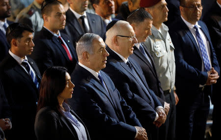 Israeli Prime Minister Benjamin Netanyahu and Israeli President Reuven Rivlin attend the funeral of Zachary Baumel, a U.S.-born Israeli soldier missing since a 1982 tank battle against Syrian forces and whose remains were recently recovered by Israel, at the Mount Herzl military cemetery in Jerusalem April 4, 2019. REUTERS/Ronen Zvulun