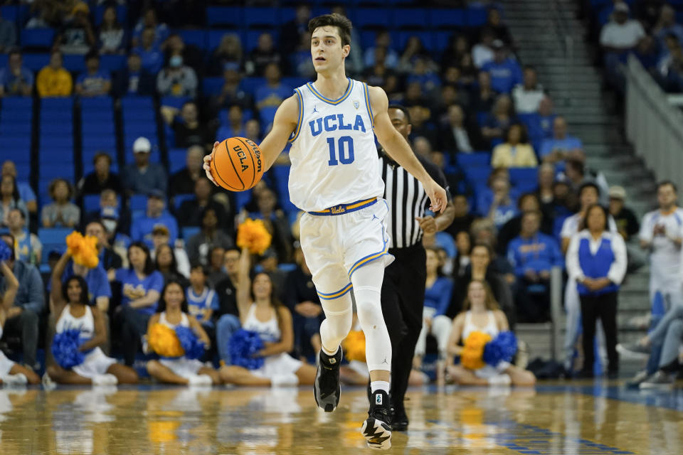 UCLA guard Lazar Stefanovic drives the ball up court during the first half of an NCAA college basketball game against St. Francis, Monday, Nov. 6, 2023, in Los Angeles. (AP Photo/Ryan Sun)