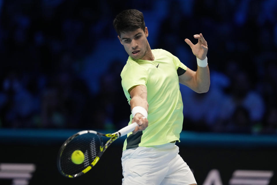 Spain's Carlos Alcaraz returns the ball to Russia's Andrej Rublev during their singles tennis match of the ATP World Tour Finals at the Pala Alpitour, in Turin, Italy, Wednesday, Nov. 15, 2023. (AP Photo/Antonio Calanni)