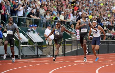 Jul 9, 2016; Eugene, OR, USA; Justin Gatlin (L) wins the 200m in 19.75 during the 2016 U.S. Olympic Team Trials at Hayward Field. From left: Gatlin, Ameer Weeb, LaShawn Merritt and Michael Norman. Mandatory Credit: Kirby Lee-USA TODAY Sports