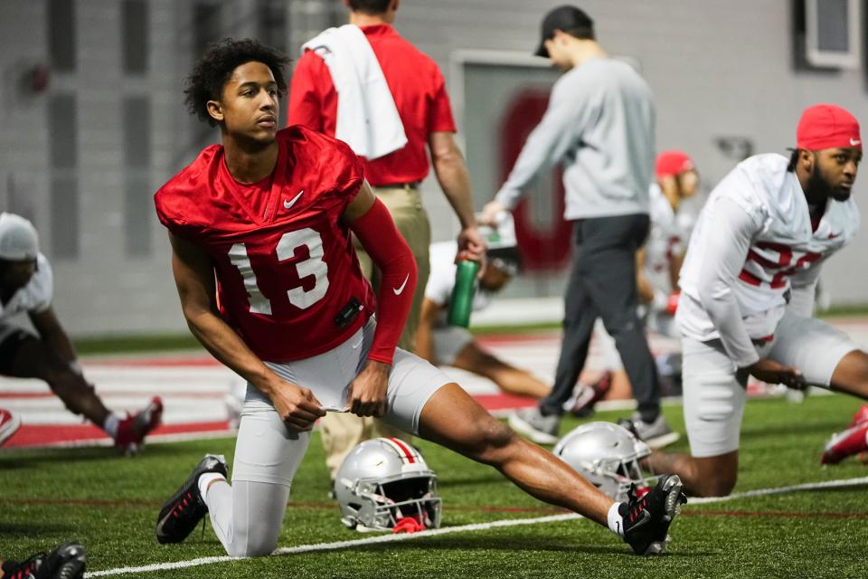 Ohio State receiver Bryson Rodgers stretches during practice last week.