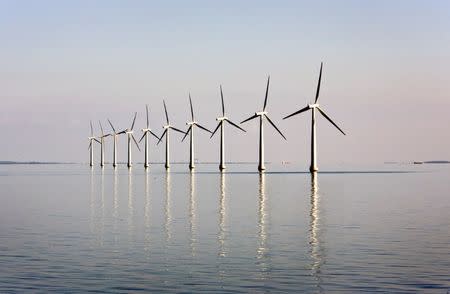 FILE PHOTO: An off-shore wind farm stands in the water near the Danish island of Samso, May 19, 2008. REUTERS/Bob Strong/File Photo