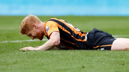 Hull City's Paul McShane lies injured. Action Images via Reuters / Craig Brough