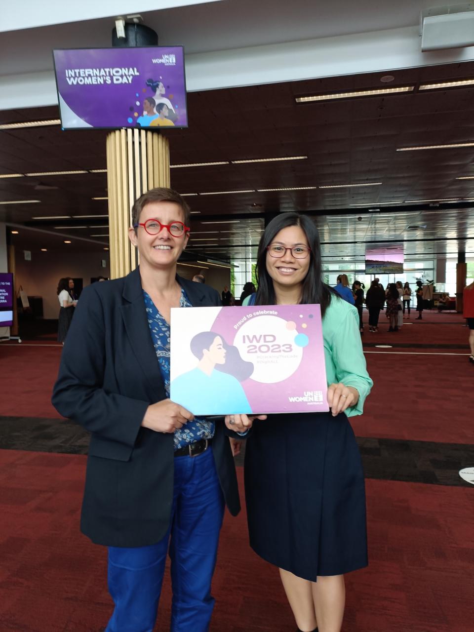 Dr Janin Bredehoeft, CEO, Science in Australia Gender Equity poses with a guest outside an International Women's Day event.