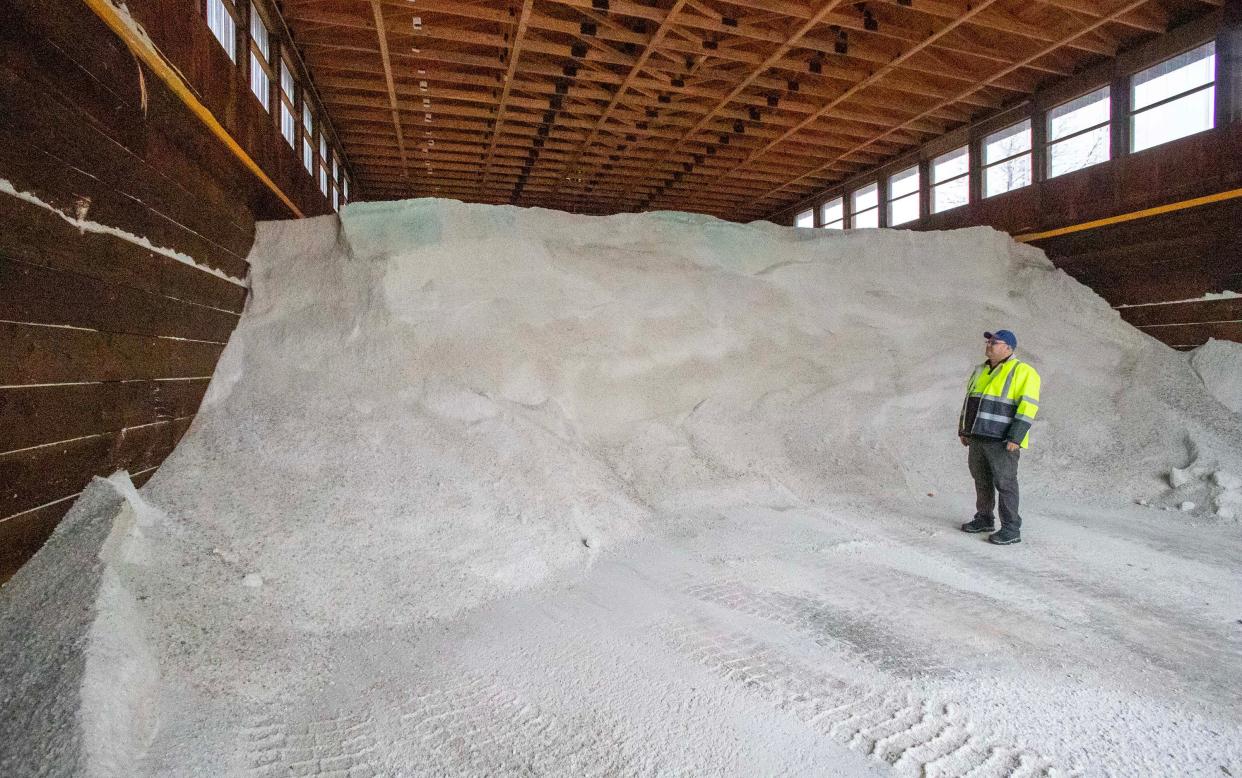 Town of Sheboygan Deputy Director of Public Works Tod Holfeltz stands by a piles of salt stored at the town’s salt shed, Tuesday, December 6, 2022, in Sheboygan, Wis.