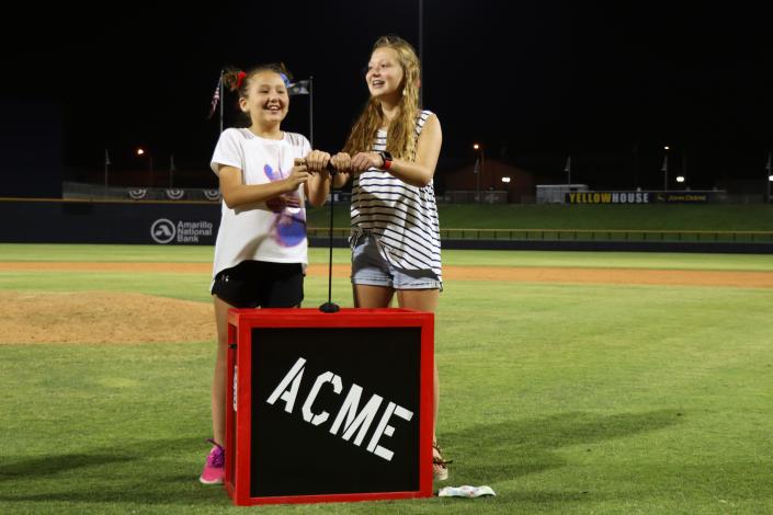 Kinsley and Braelyn Tingle had the honor of pushing the plunger to start the Hodgetown Stadium fireworks display on July 4 in this file photo.