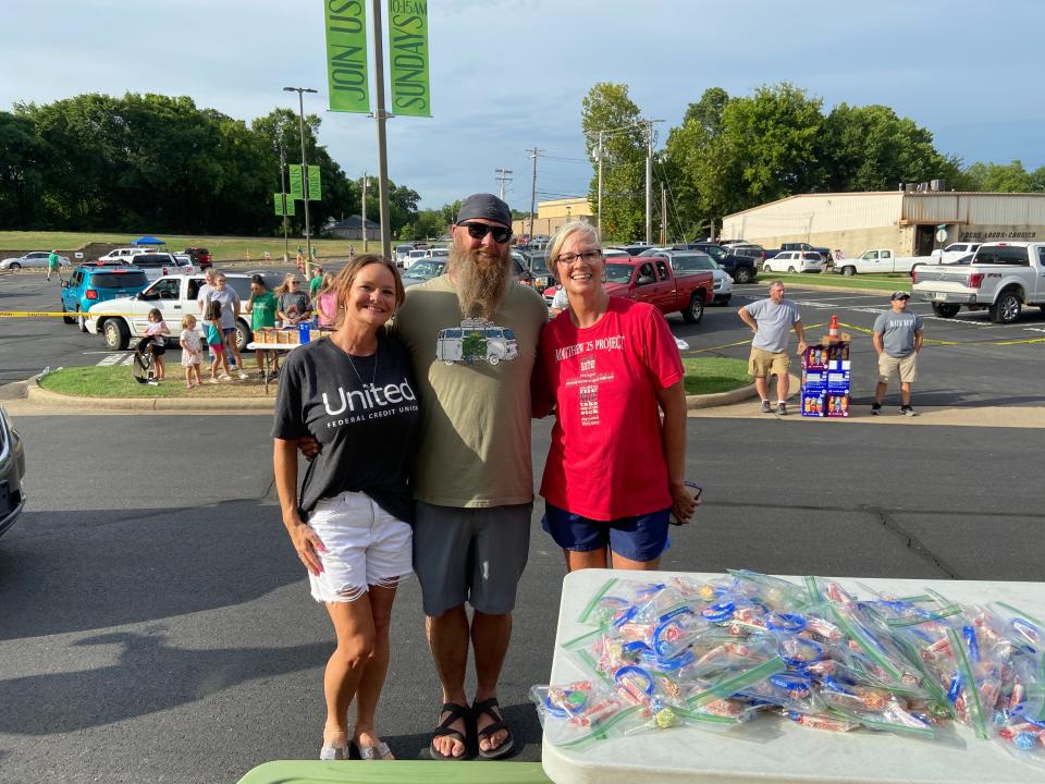Kim Wilson of United Federal Credit Union and Karen Beckner, Matthew 25 Project founder stand with a volunteer at the Back to School Bash at First Baptist Church in Van Buren.
